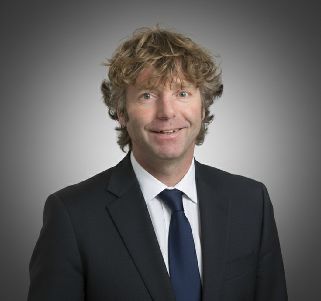 A professional headshot of Dr. Markus Wimmer