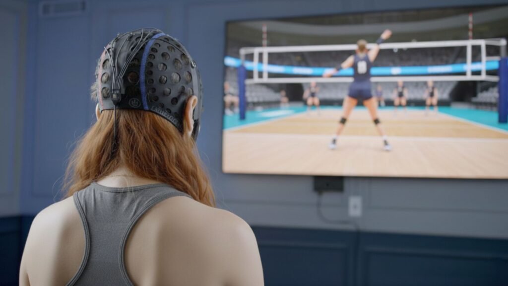 A youth volleyball athlete wears the EEG cap and plays volleyball with her mind using i-Brain tech at Synapse SRT at Sawmill Sports Hub.