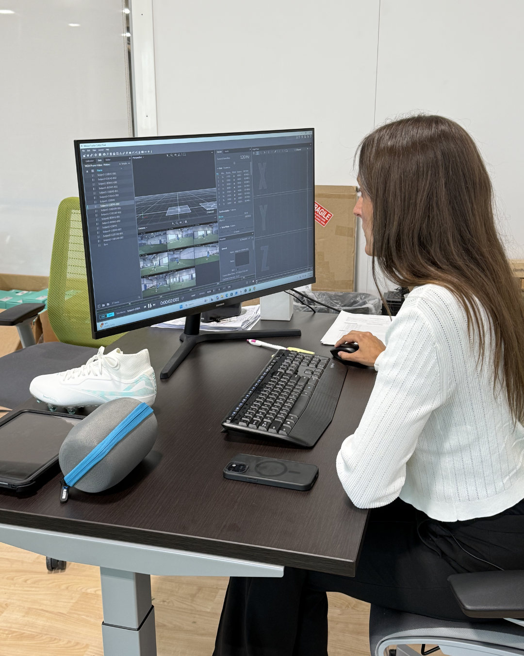 A biomechanics engineer studies the computer.