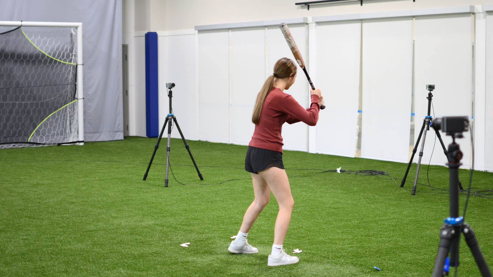 A young softball player takes part in a motion analysis study at Synapse SRT.